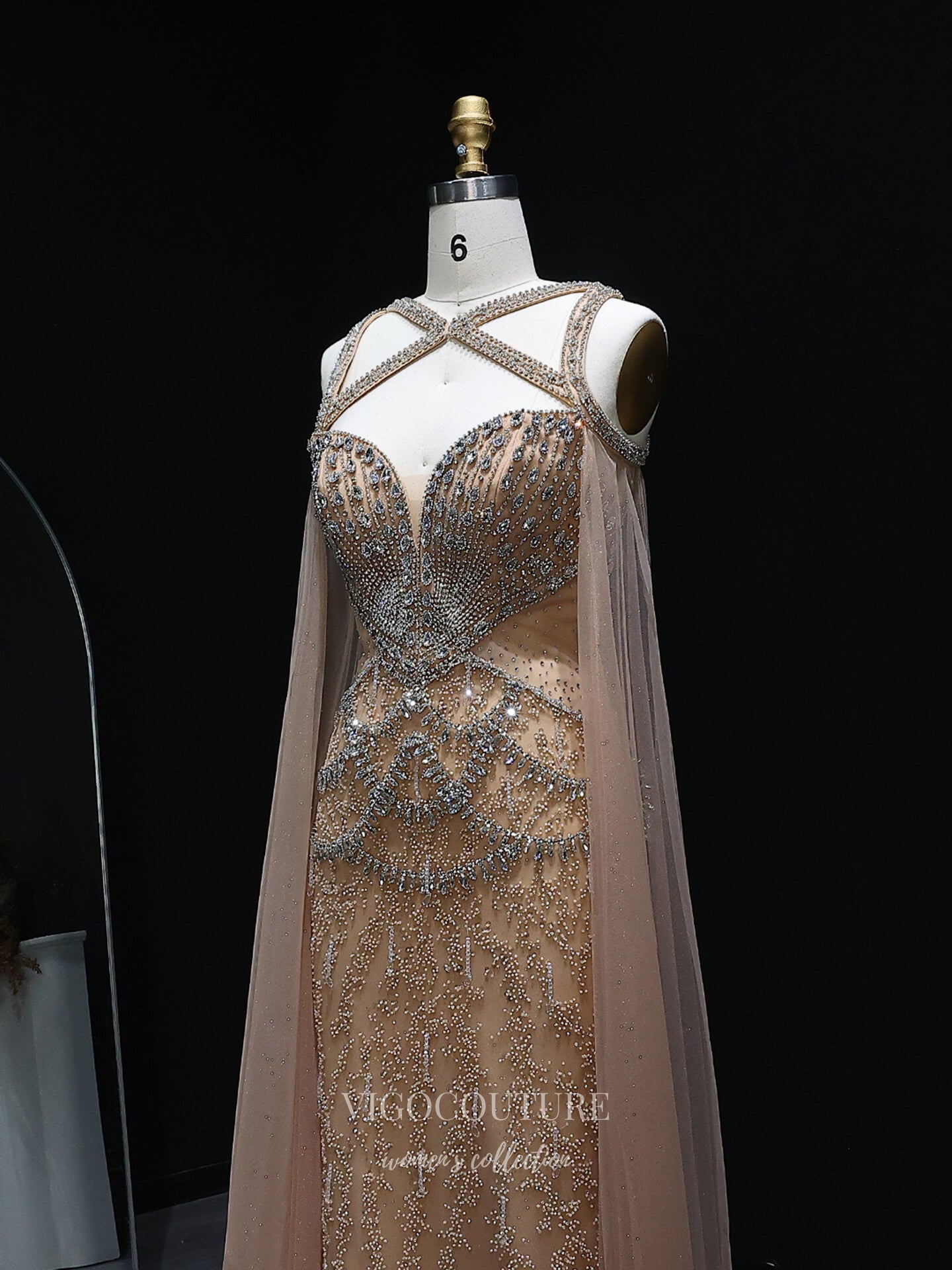 Evening Gown 2025 to impress Champagne Beaded Sheath Evening Gown with Illusion Crisscross Neckline, Open Back & Cape Panels – 26038-vigocouture-vigocouture