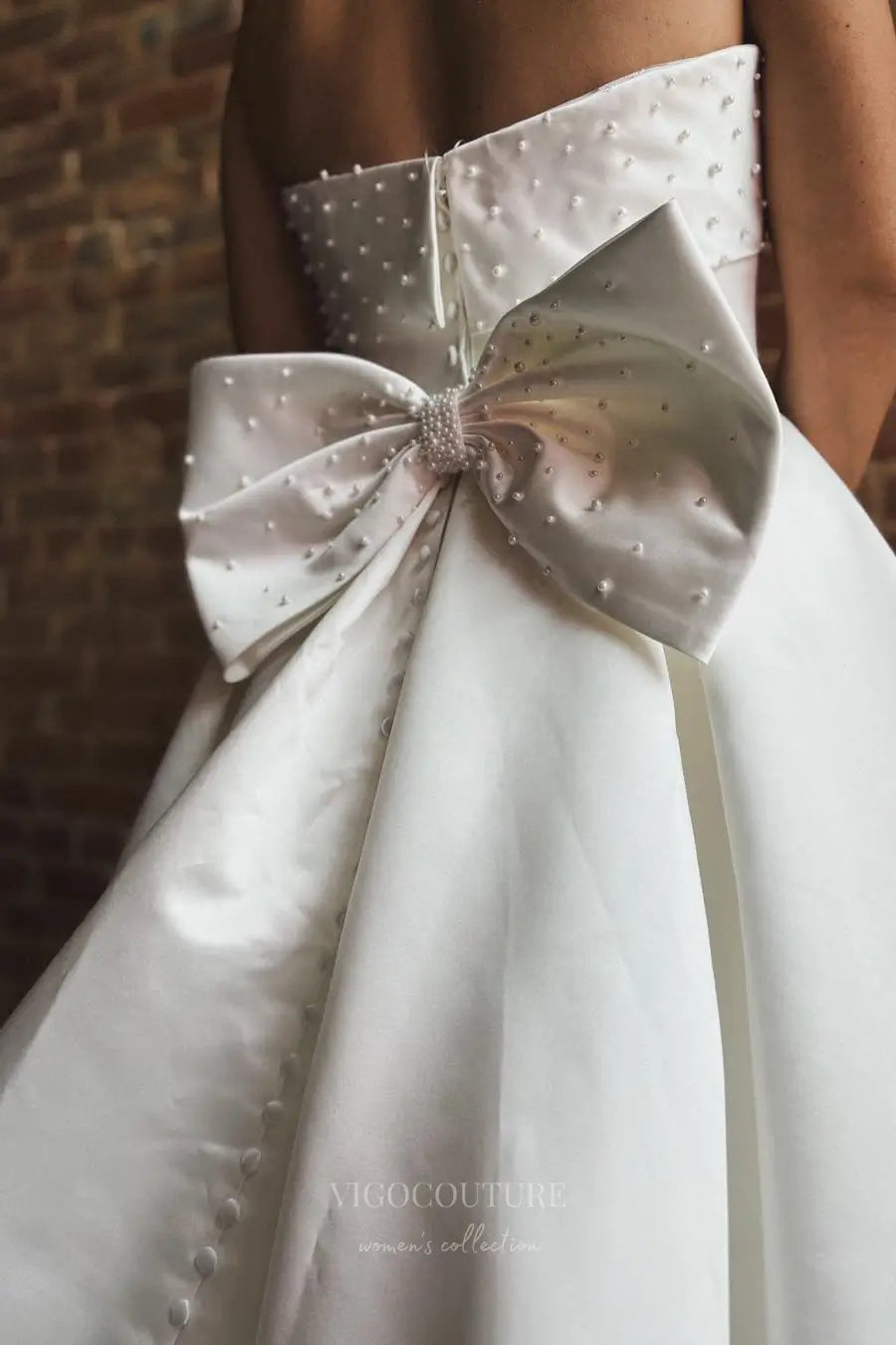 Wedding Dresses 2025 to impress Elegant Satin Strapless Wedding Dress with Pearl Embellished Neckline, Bow Back, Pockets and Button Train – W2362-vigocouture-vigocouture