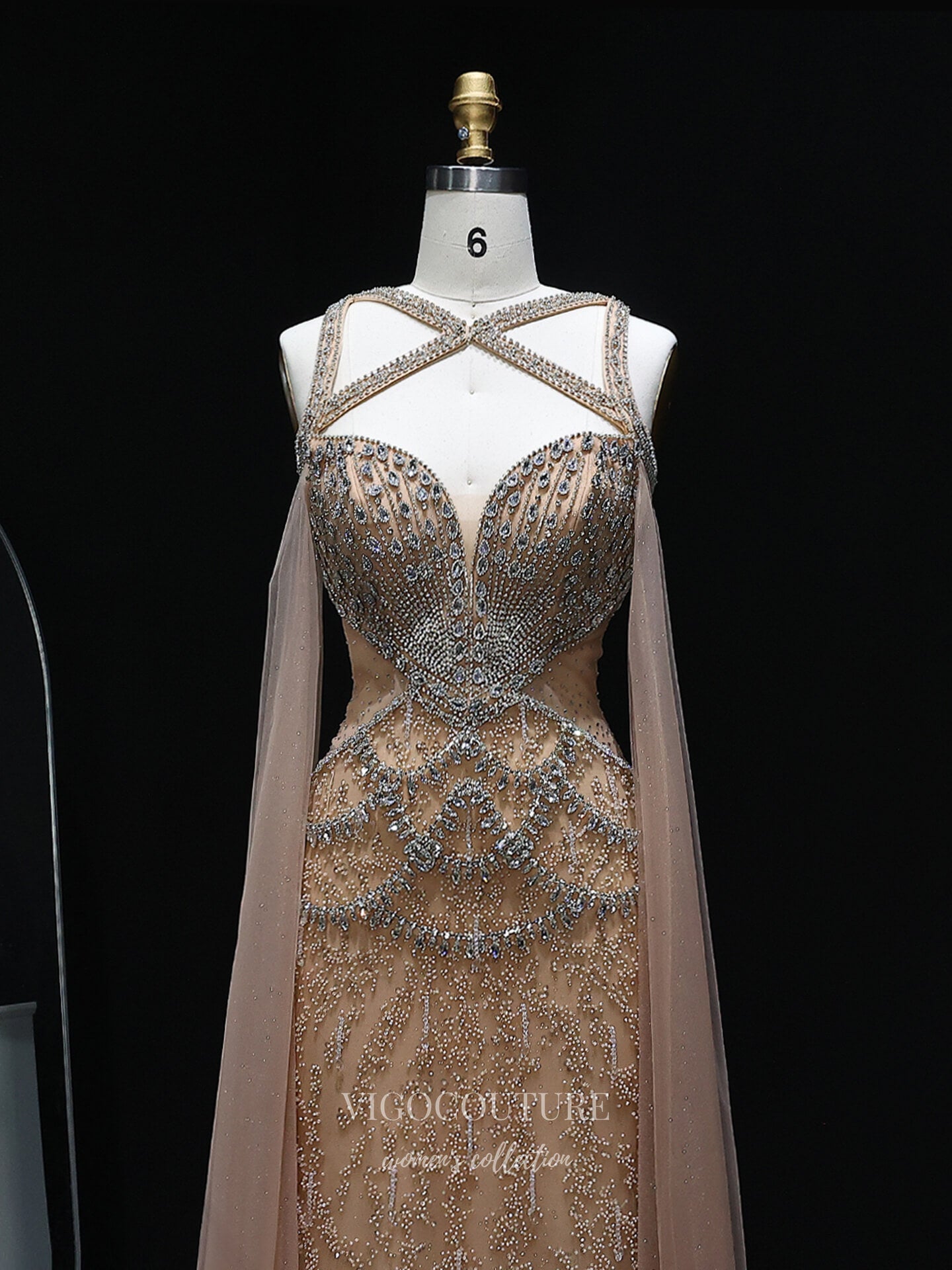 Evening Gown 2025 to impress Champagne Beaded Sheath Evening Gown with Illusion Crisscross Neckline, Open Back & Cape Panels – 26038-vigocouture-vigocouture