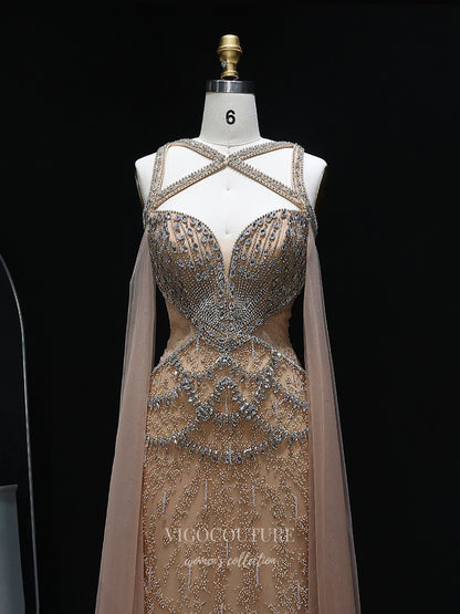 Evening Gown 2025 to impress Champagne Beaded Sheath Evening Gown with Illusion Crisscross Neckline, Open Back & Cape Panels – 26038-vigocouture-vigocouture
