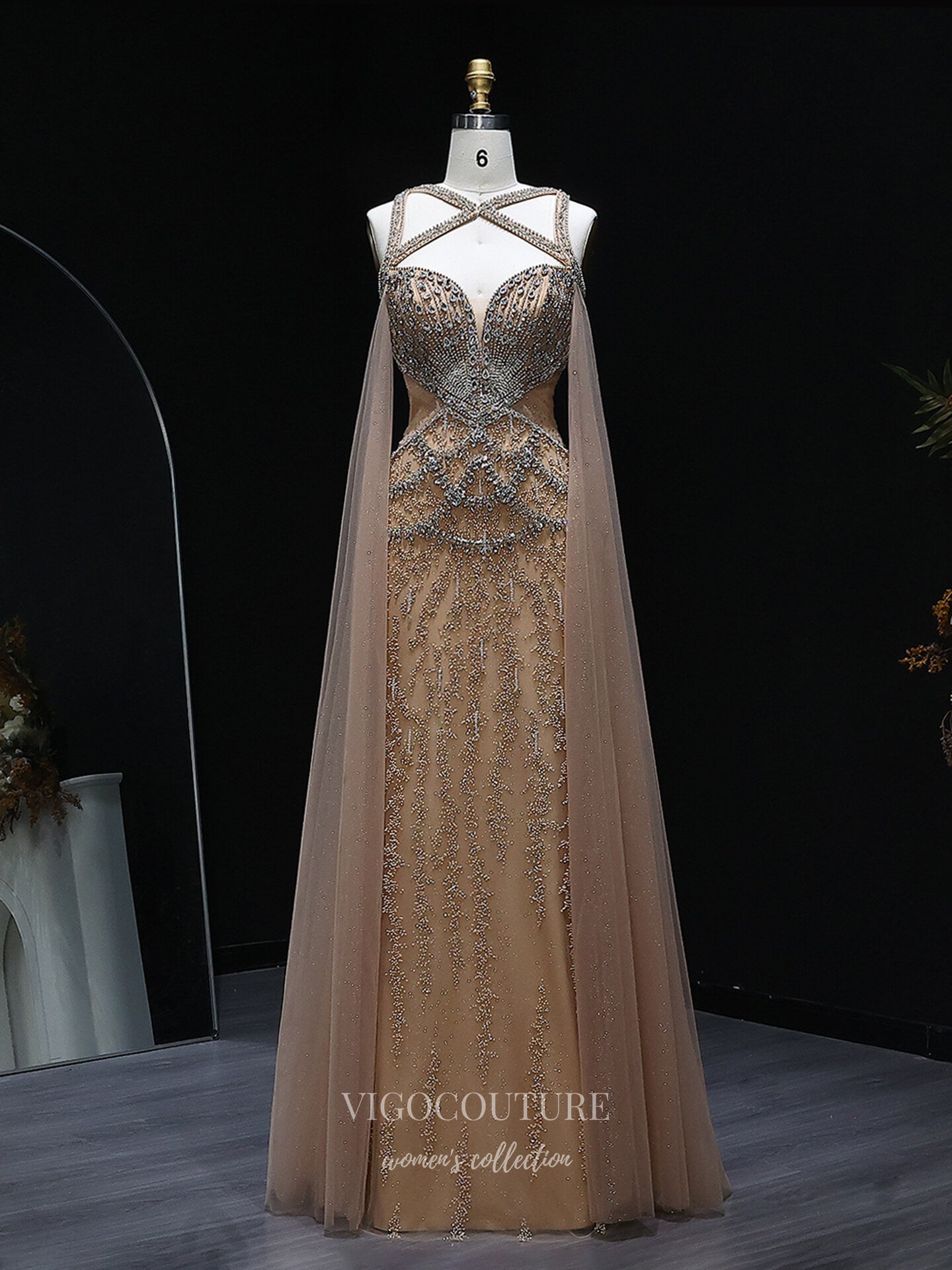 Champagne Beaded Sheath Evening Gown with Illusion Crisscross Neckline, Open Back & Cape Panels – 26038