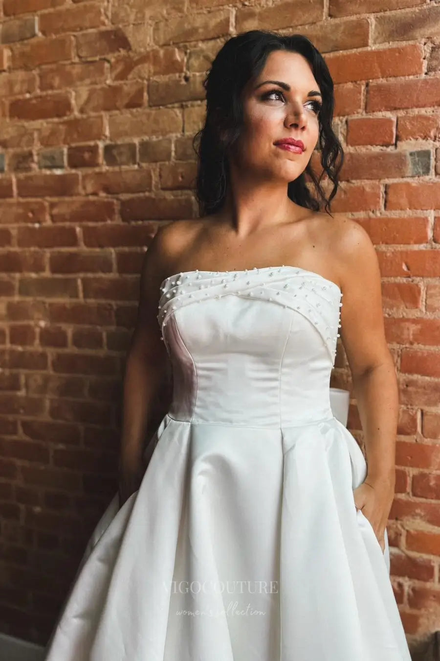 Wedding Dresses 2025 to impress Elegant Satin Strapless Wedding Dress with Pearl Embellished Neckline, Bow Back, Pockets and Button Train – W2362-vigocouture-vigocouture