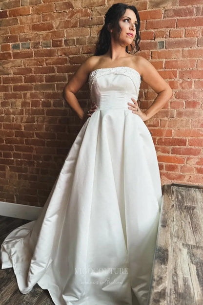 Elegant Satin Strapless Wedding Dress with Pearl Embellished Neckline, Bow Back, Pockets and Button Train – W2362