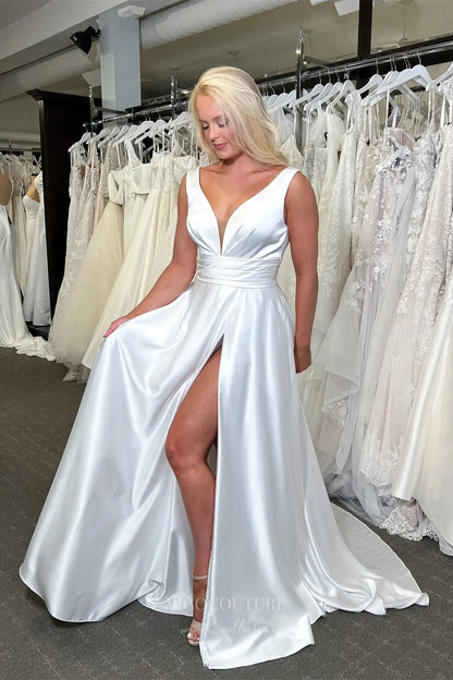 Lustrous Ivory Satin Wedding Dress with Deep V-Neckline, Draped Waist & High Slit – W2349